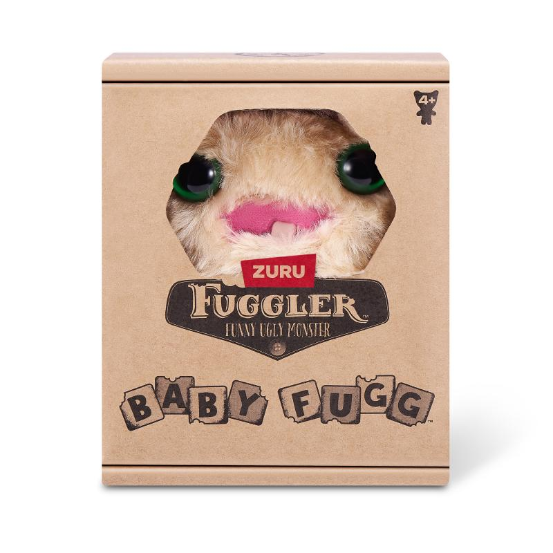 Eine Fuggler-Spielzeugbox. Ein beiges Monster mit grünen Augen und rosa Mund ist sichtbar. Auf der Schachtel steht 'Fuggler, Funny Ugly Monster'.