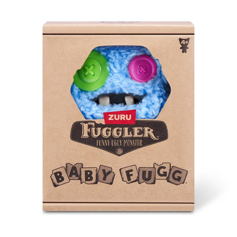 Eine Spielzeugbox 'Baby Fuggler'. Sie zeigt ein blaues Monster mit grünen und rosa Knopfaugen. Die Box ist braun und trägt den Namen des Spielzeugs.