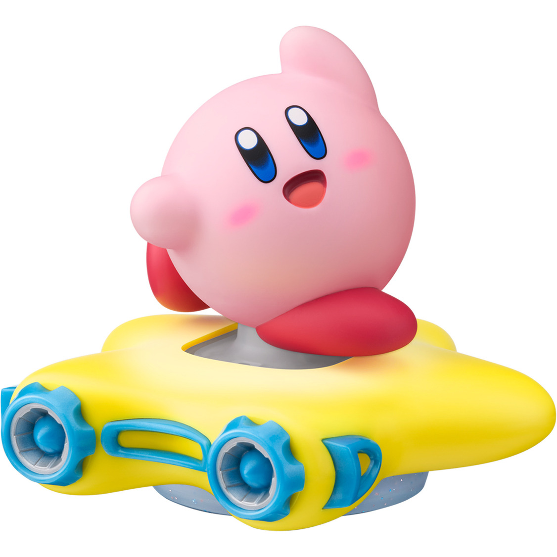 Una figura rosa de Kirby en un vehículo amarillo en forma de estrella. Kirby tiene ojos azules y una cara sonriente. El vehículo tiene ruedas azules.