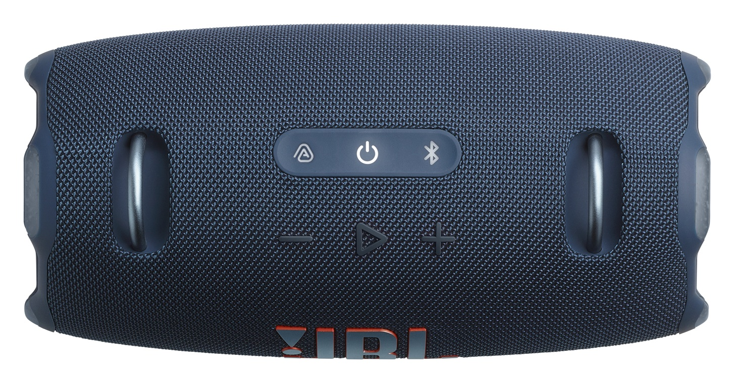 Ciemnoniebieski głośnik JBL. Posiada przyciski zasilania, Bluetooth, głośności i odtwarzania. Logo JBL znajduje się na dole.