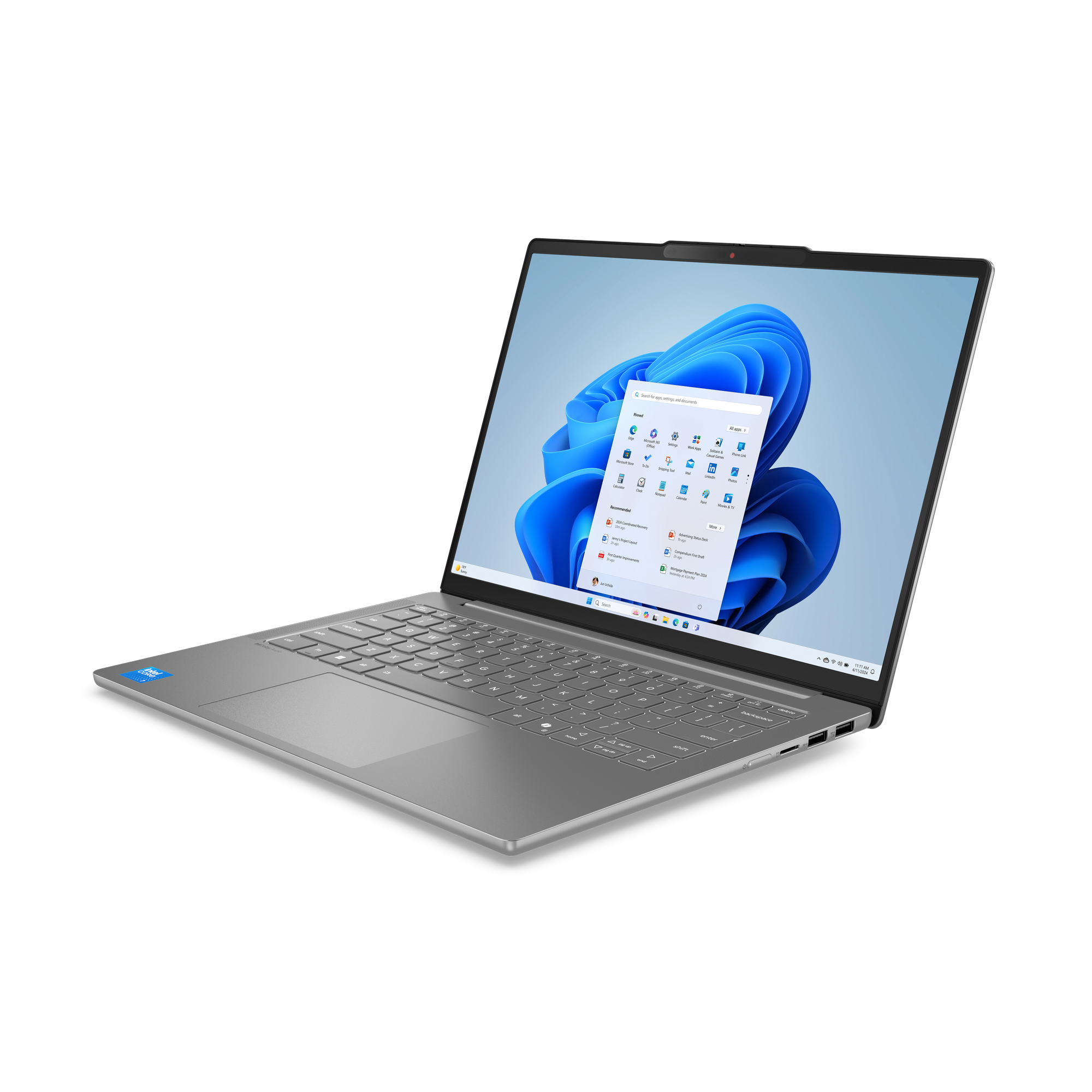 Silberner Laptop auf schwarzem Hintergrund, geöffnet mit Windows 11. Tastatur sichtbar. Bildschirm zeigt App-Symbole und Suchleiste.