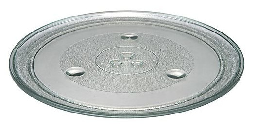 Przezroczysty, szklany talerz do kuchenki mikrofalowej, okrągły, z teksturowanym środkiem i trzema małymi wypukłościami. Symbol kuchenki mikrofalowej jest na środku.