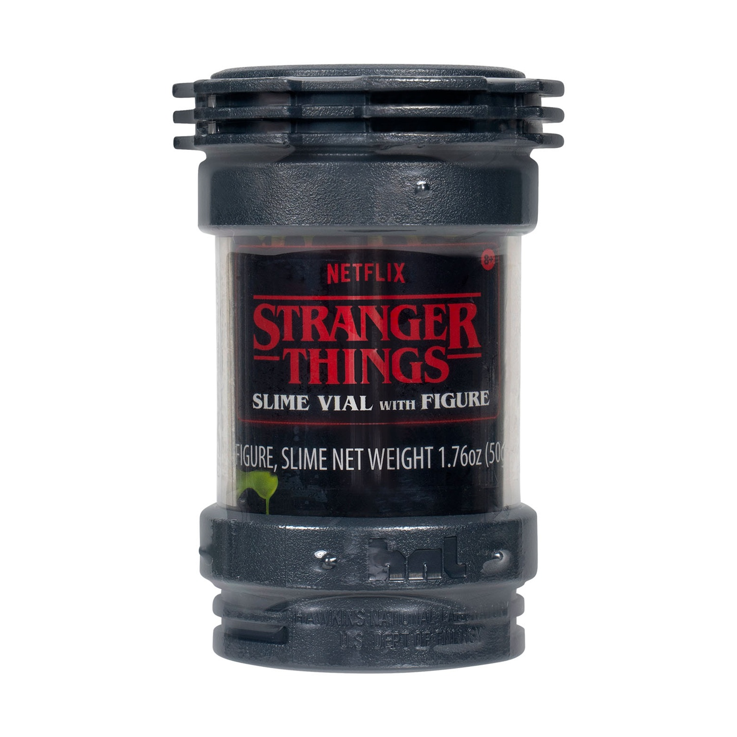 Un flacone di slime di 'Stranger Things' con una figura all'interno. Il flacone è grigio scuro con il logo dello show in rosso. Lo slime verde è visibile.