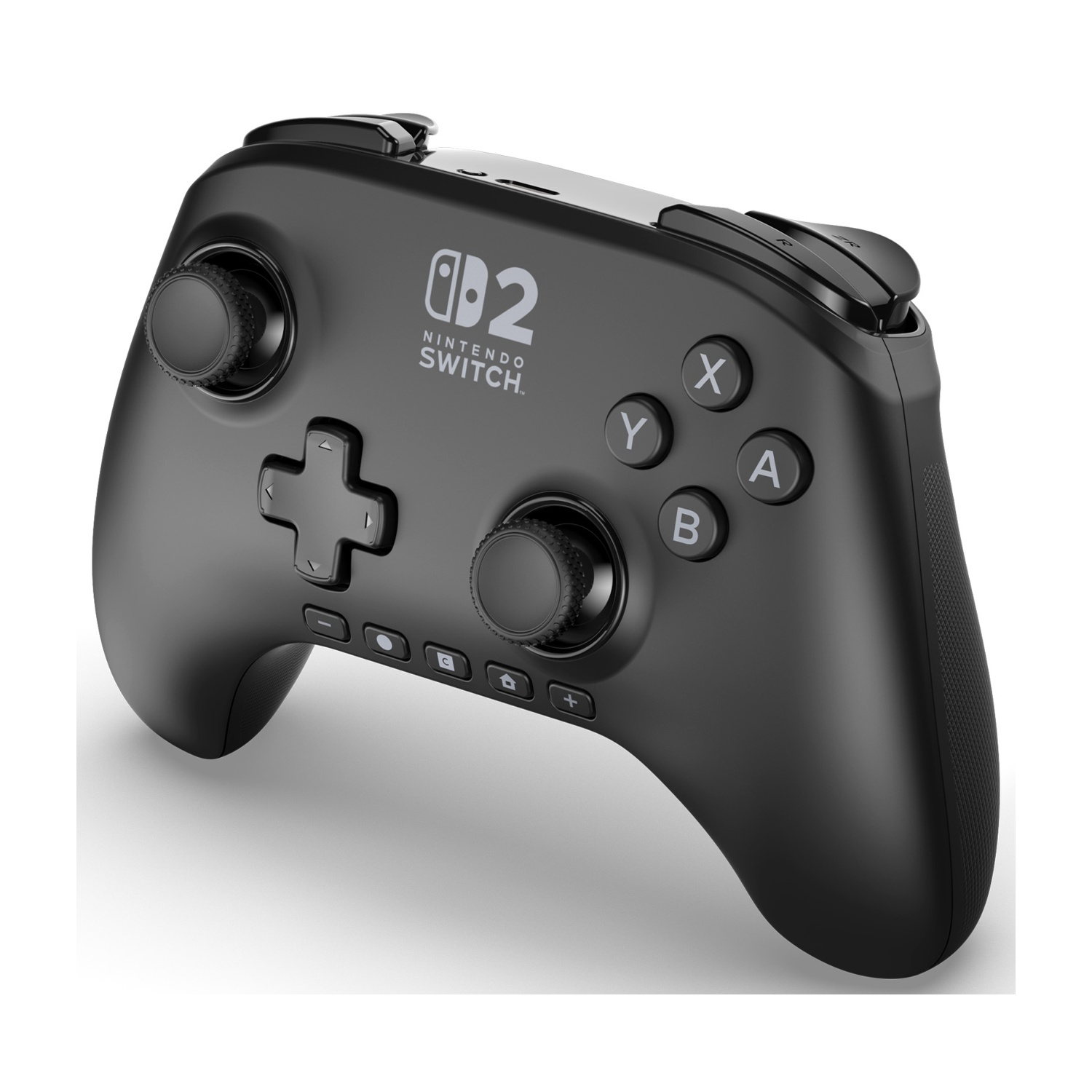 Un controller nero per Nintendo Switch. Ha pulsanti, joystick e il logo Nintendo Switch. Poggia su una superficie bianca.