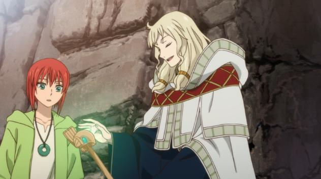 Animeszene. Ein rothaariges Mädchen und ein blonder Mann mit einem Zauberstab in einer Höhle. Das Mädchen sieht überrascht aus, der Mann lächelt.