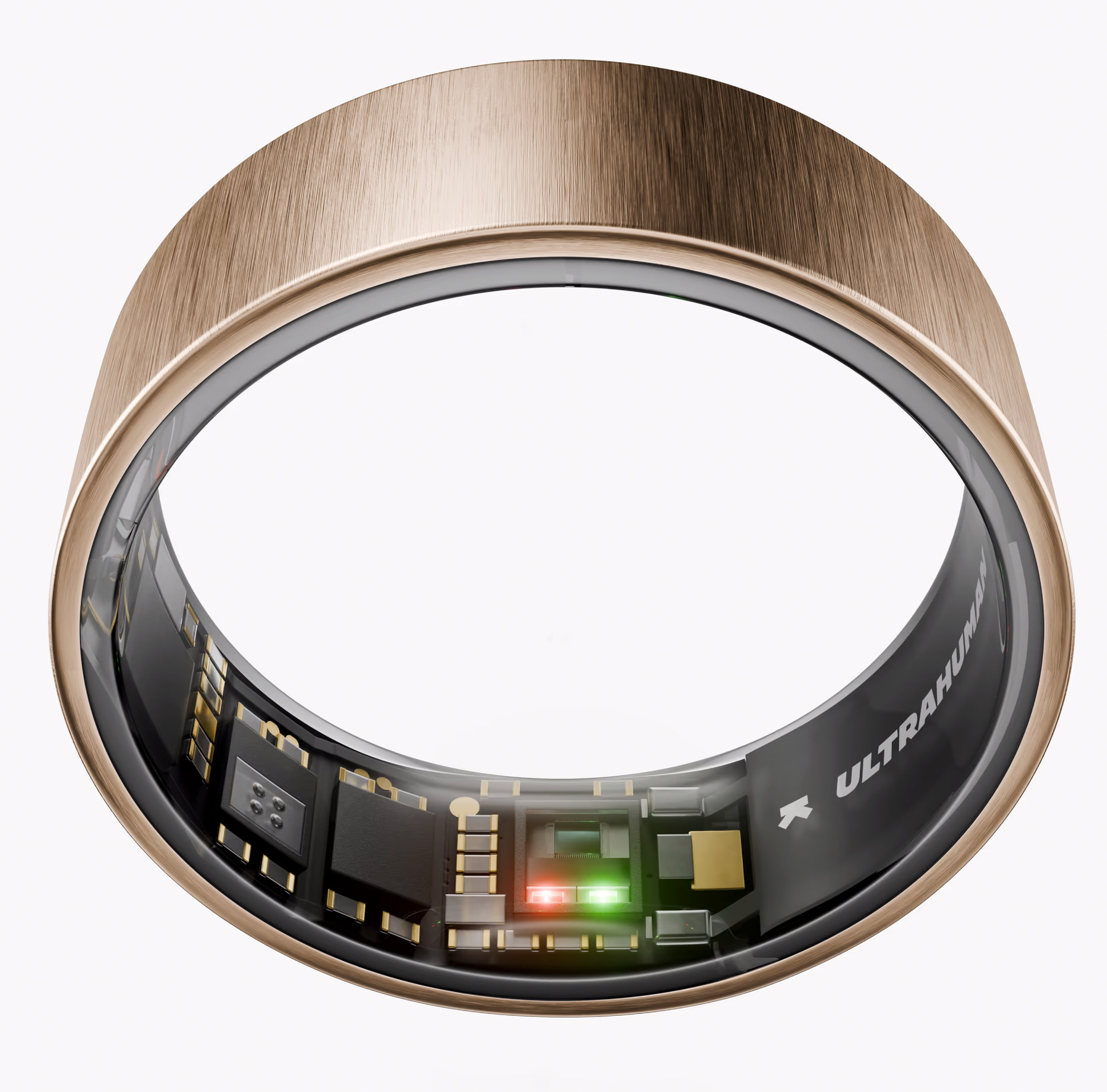 Złoty inteligentny pierścień z widocznym obwodem wewnętrznym. Ma czerwone i zielone światła. Na pierścieniu napis 'ULTRAHUMAN'.