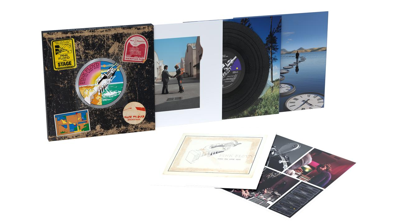 Pink Floyds Album 'Wish You Were Here'. Cover und Schallplatte sichtbar. Das Albumcover hat Aufkleber. Weitere Bilder zeigen eine Vinylplatte.