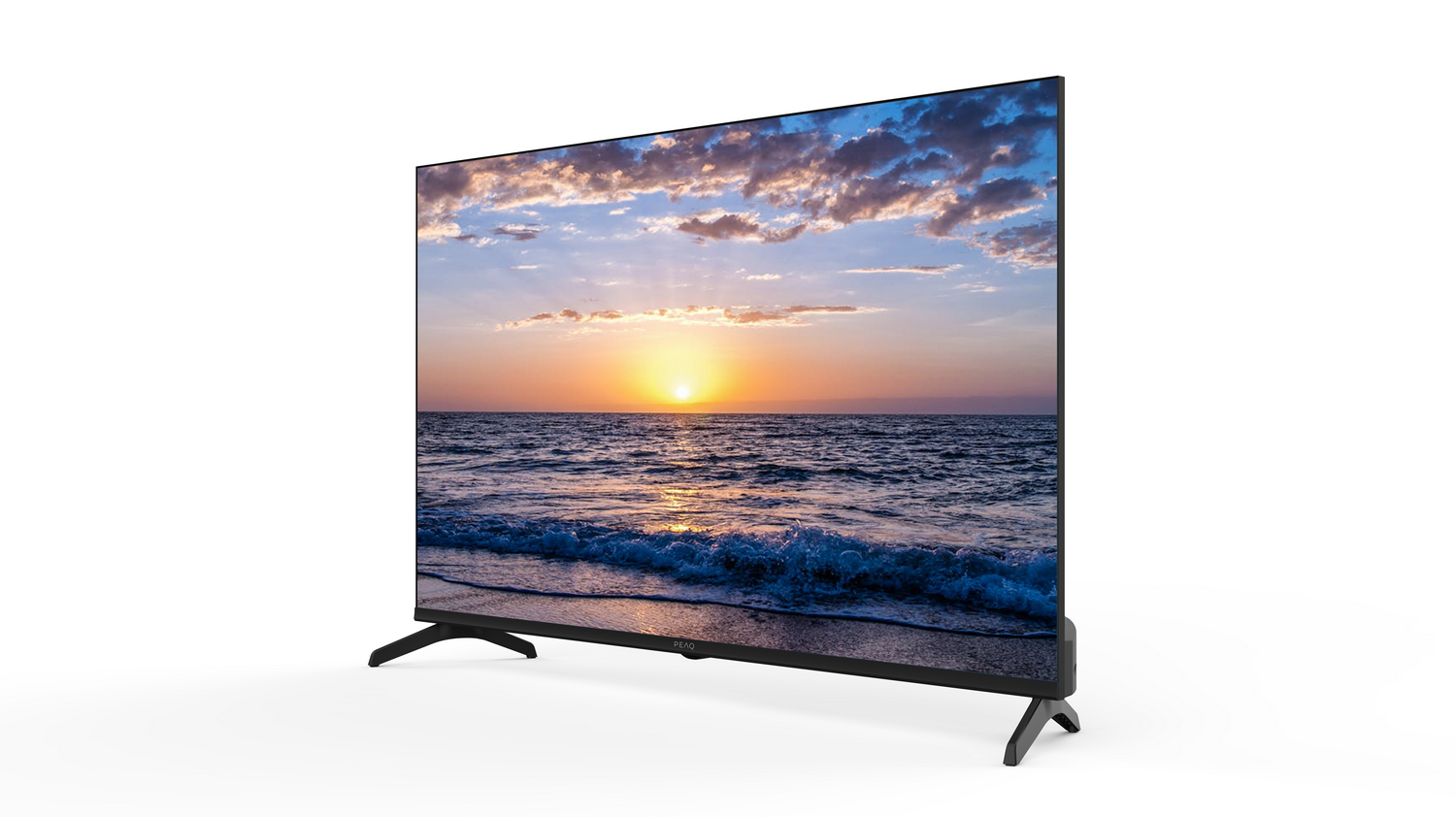 Un televisor muestra una puesta de sol sobre el océano. La pantalla muestra un sol naranja, cielo azul y olas. El televisor tiene patas negras.