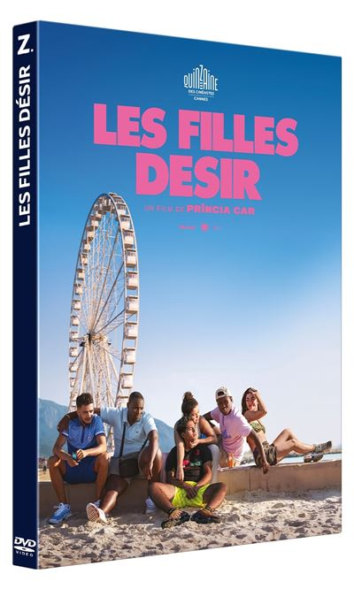 Couverture DVD : Titre 'Les Filles Désir', groupe de personnes sur une plage, grande roue et ciel bleu.