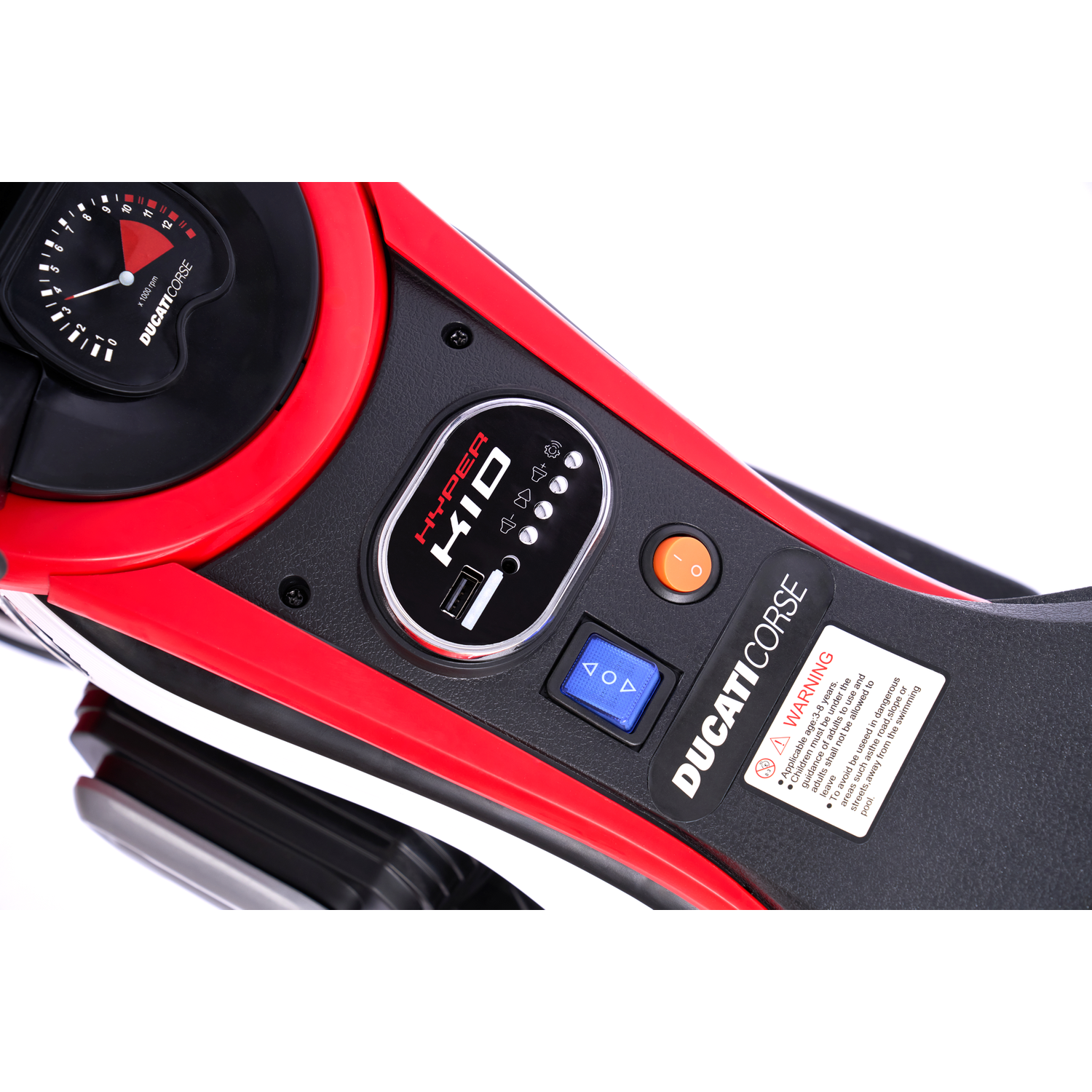 A red and black toy motorcycle dashboard with gauges, buttons, and warning labels. Features Ducati Corse branding and Hyper Kid logo.