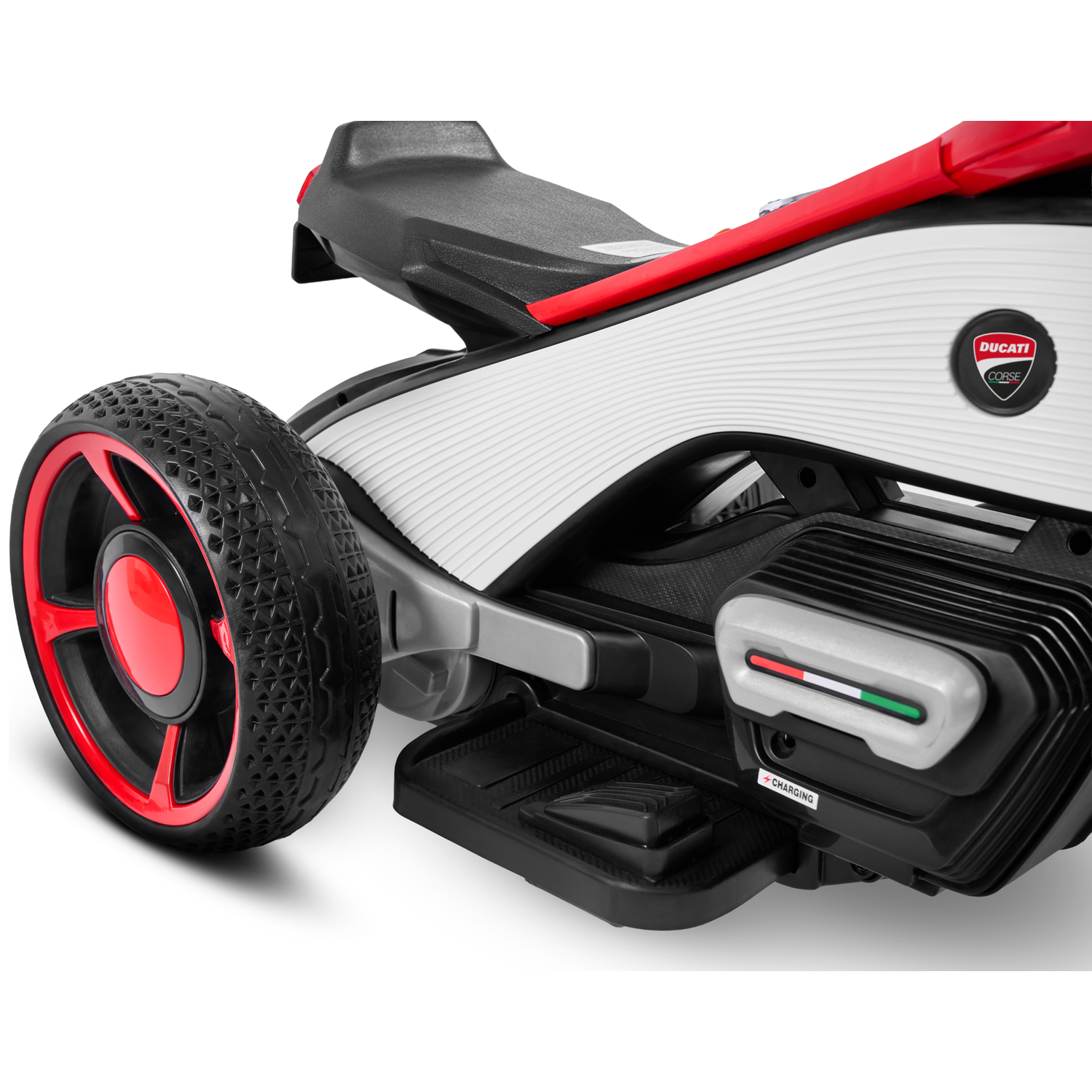 Close-up of a toy Ducati motorcycle. It features a black and red wheel, white and black body, and a red seat, with a Ducati Corse logo.