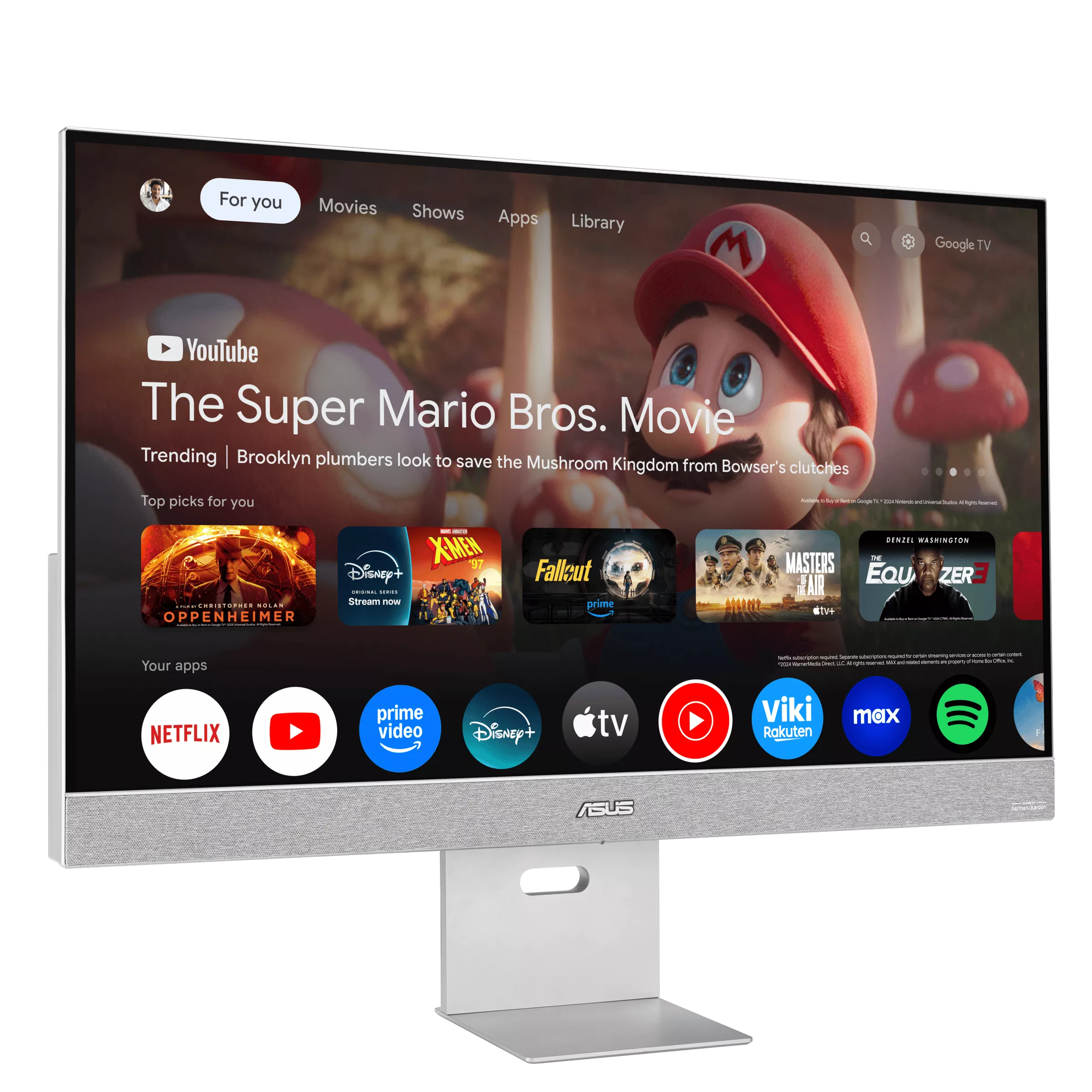 Egy számítógép monitor egy YouTube felületet jelenít meg, a 'The Super Mario Bros. Movie'-t népszerűsítve, különféle alkalmazásikonokkal.