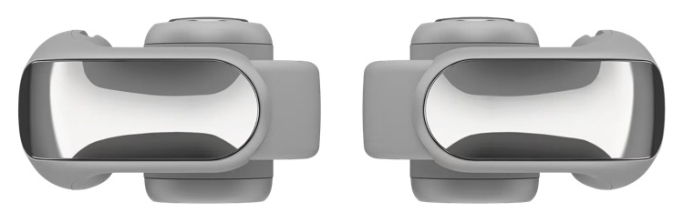 Wyświetlane są dwa szare, futurystycznie wyglądające urządzenia. Każde ma błyszczącą, srebrną część centralną i zaokrąglone szare krawędzie.