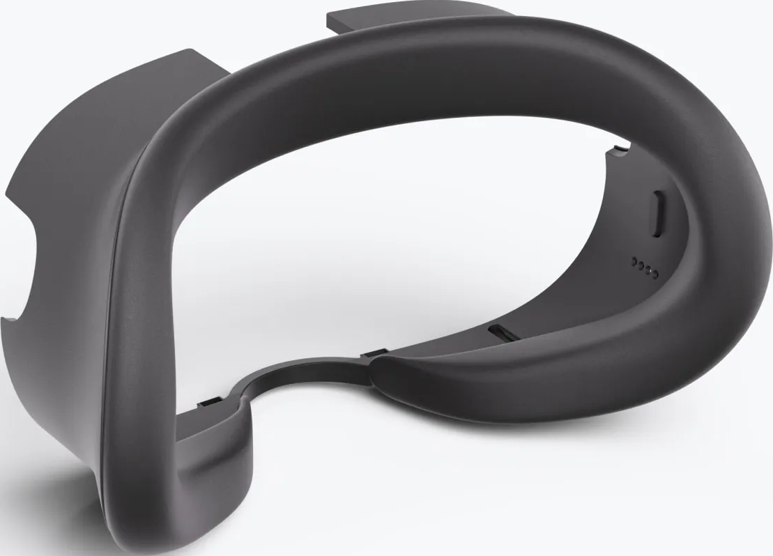 Un telaio per cuffie VR grigio scuro, curvo e arrotondato. Ha una superficie liscia ed è su sfondo bianco.