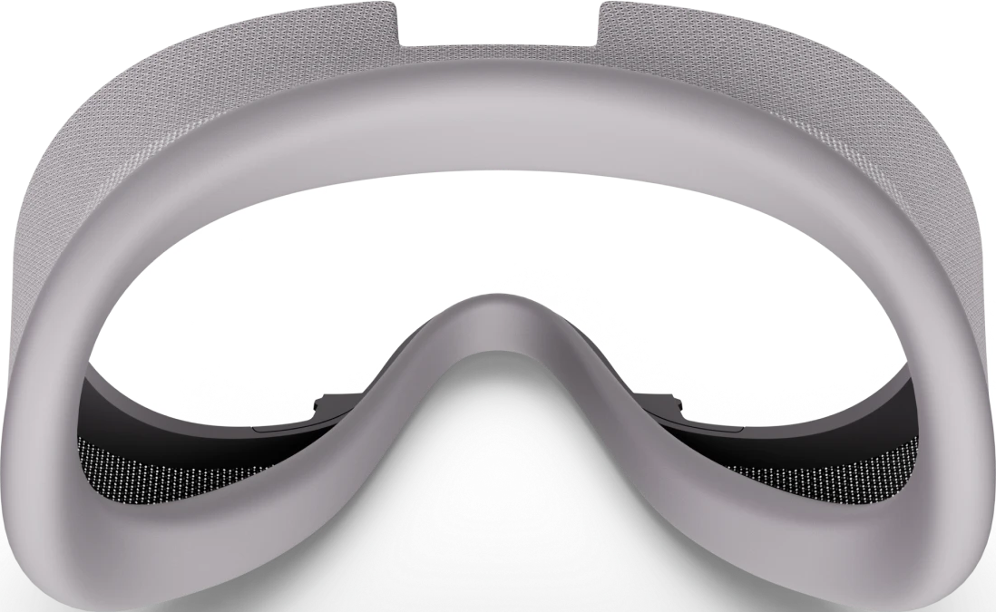Un visore VR grigio chiaro con cinturino in mesh. Le lenti sono scure. Il visore ha un design liscio e curvo.