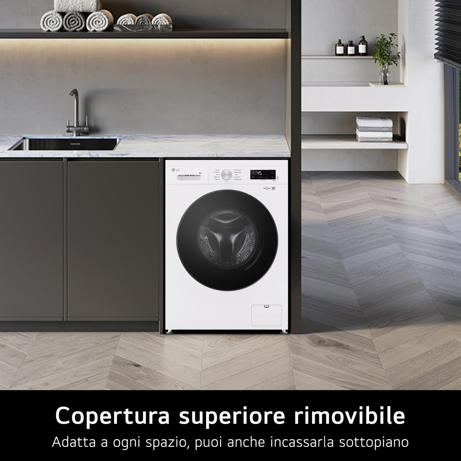 Lavatrice bianca con porta nera in una lavanderia moderna. Asciugamani e lavandino sullo sfondo.