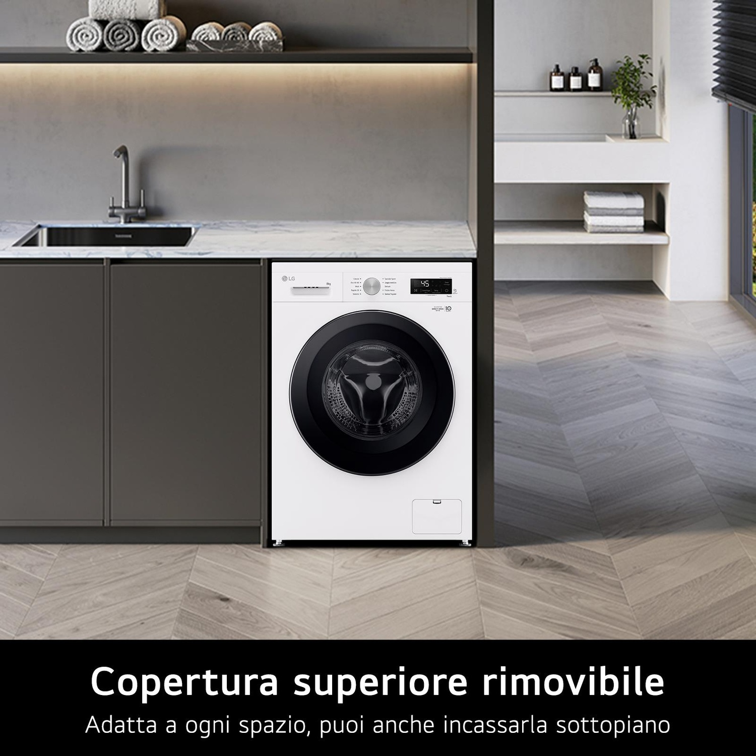 Una lavatrice LG bianca si trova in una moderna lavanderia. La stanza presenta un lavandino, asciugamani e pavimento in legno.