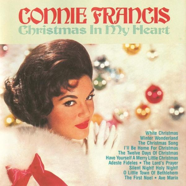 Albumcover für Connie Francis, 'Christmas In My Heart'. Sie trägt einen weißen Pelzkragen und roten Lippenstift, mit Weihnachtsschmuck.