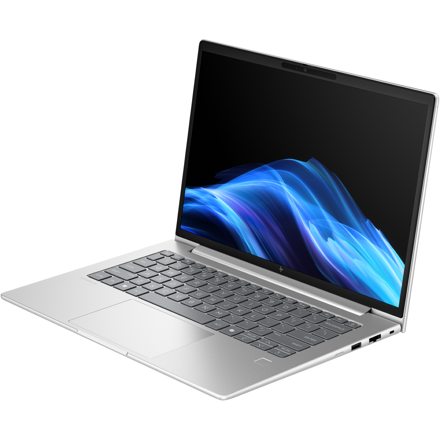 A silver laptop is open, displaying a blue and white abstract design on the screen. The keyboard and trackpad are visible.