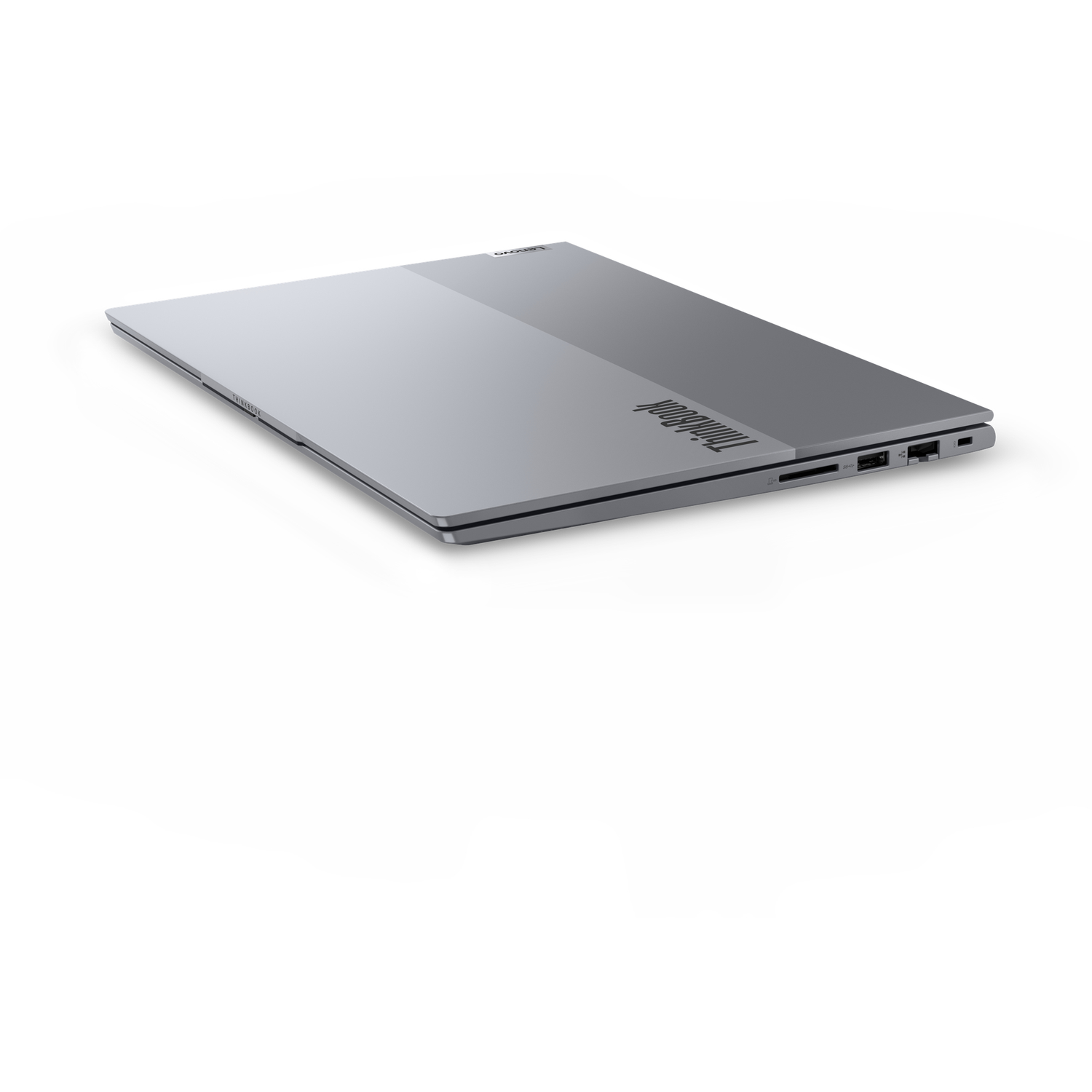 A closed silver Lenovo ThinkBook laptop on a white background. The laptop is slightly angled, showcasing its side profile.