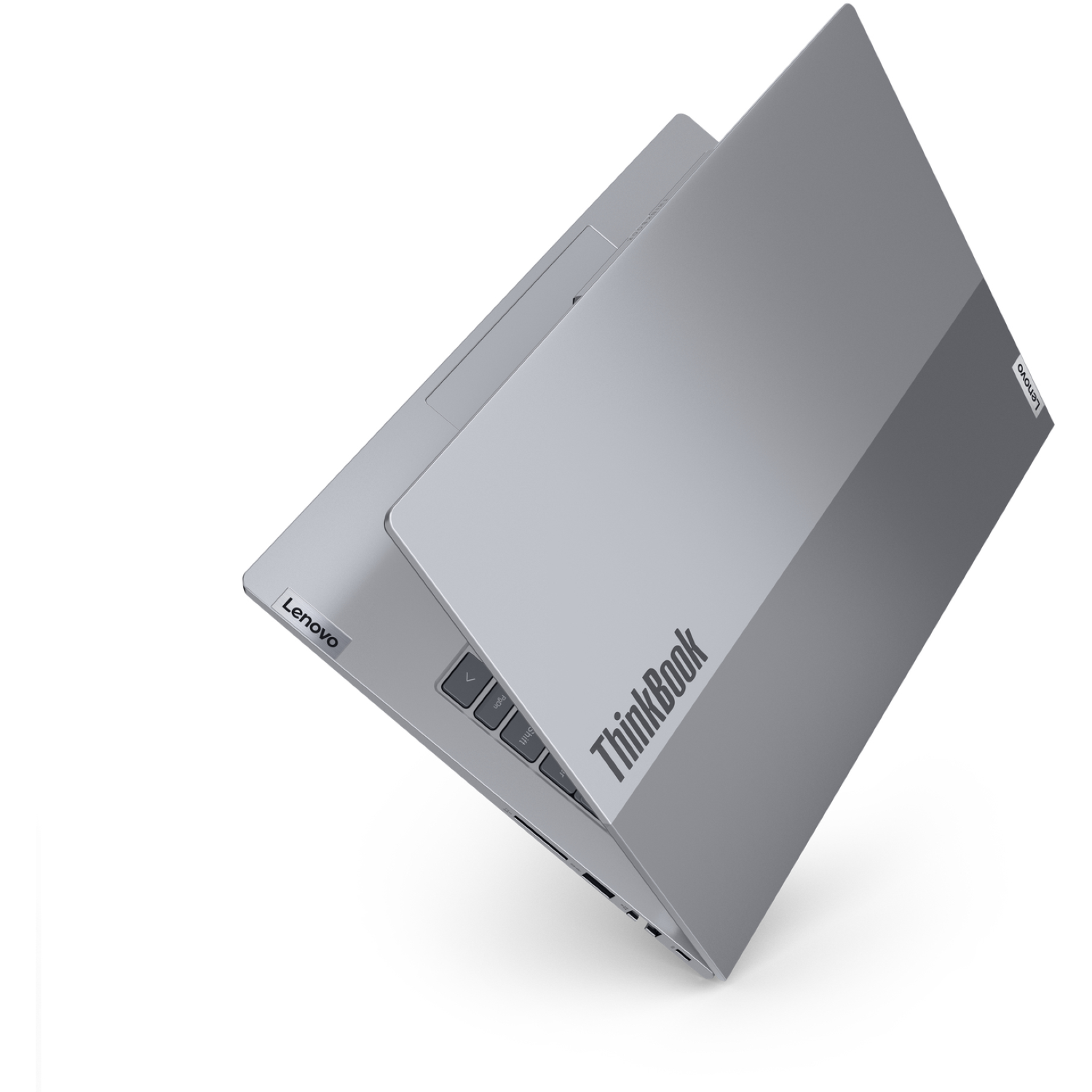 A gray Lenovo ThinkBook laptop is slightly open, showing the keyboard and screen. The Lenovo logo is visible.