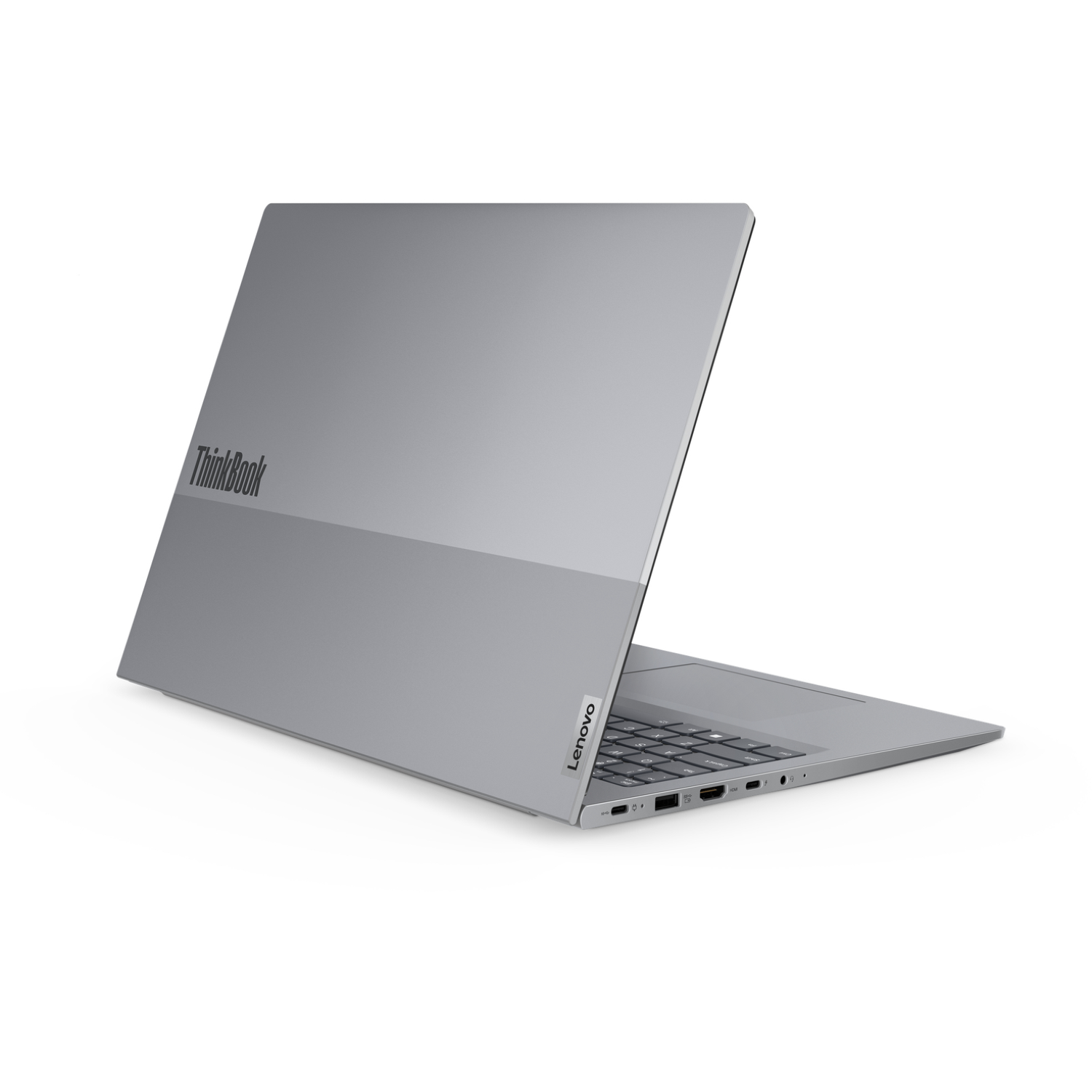 A silver Lenovo ThinkBook laptop is slightly open, showing the keyboard and ports. The Lenovo logo is visible.