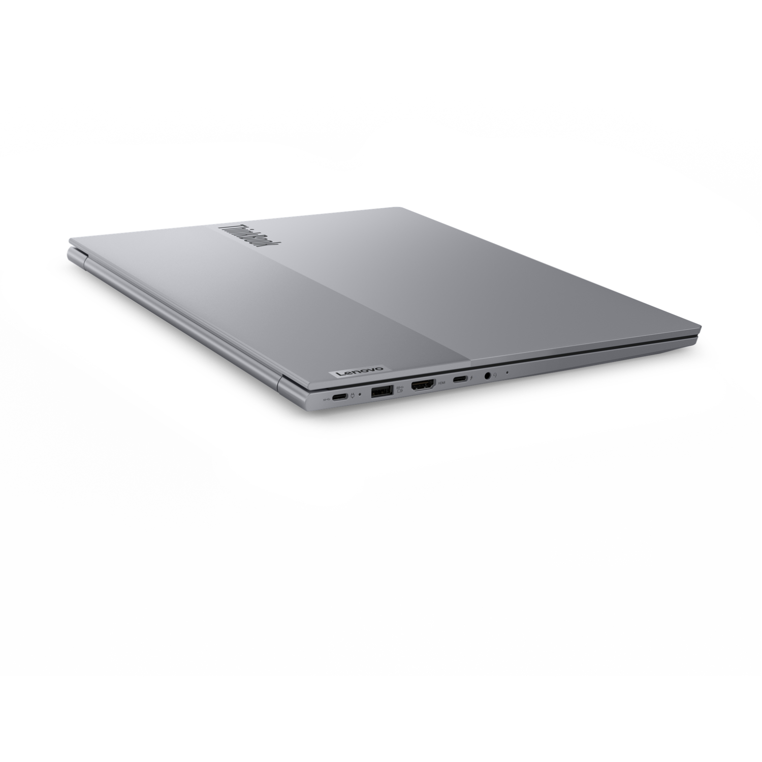 A closed, silver Lenovo ThinkBook laptop on a white background. The ThinkBook logo is visible on the top, with a Lenovo logo on the side.