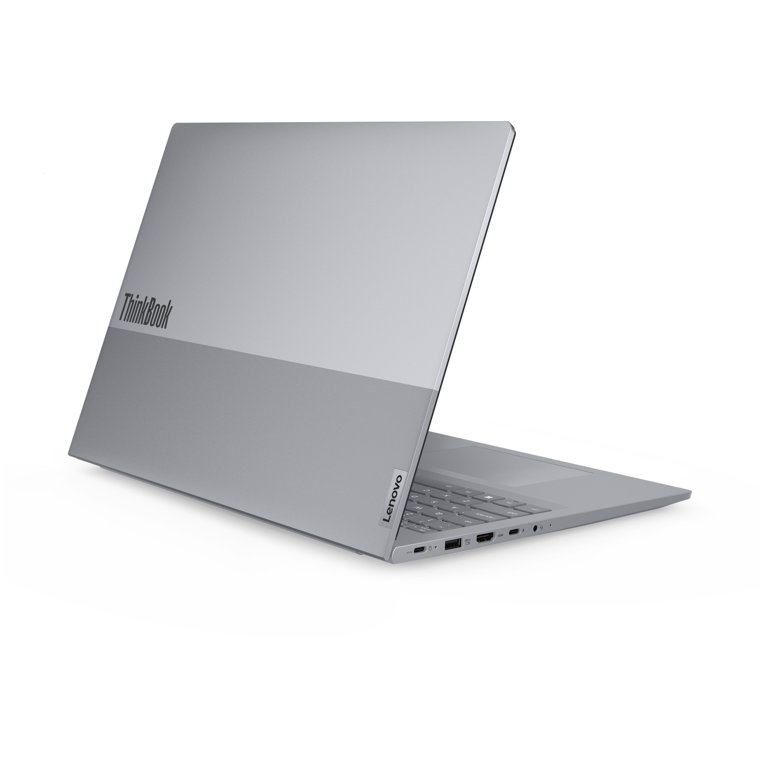A silver Lenovo ThinkBook laptop is slightly open, angled to the right. The Lenovo logo is visible.