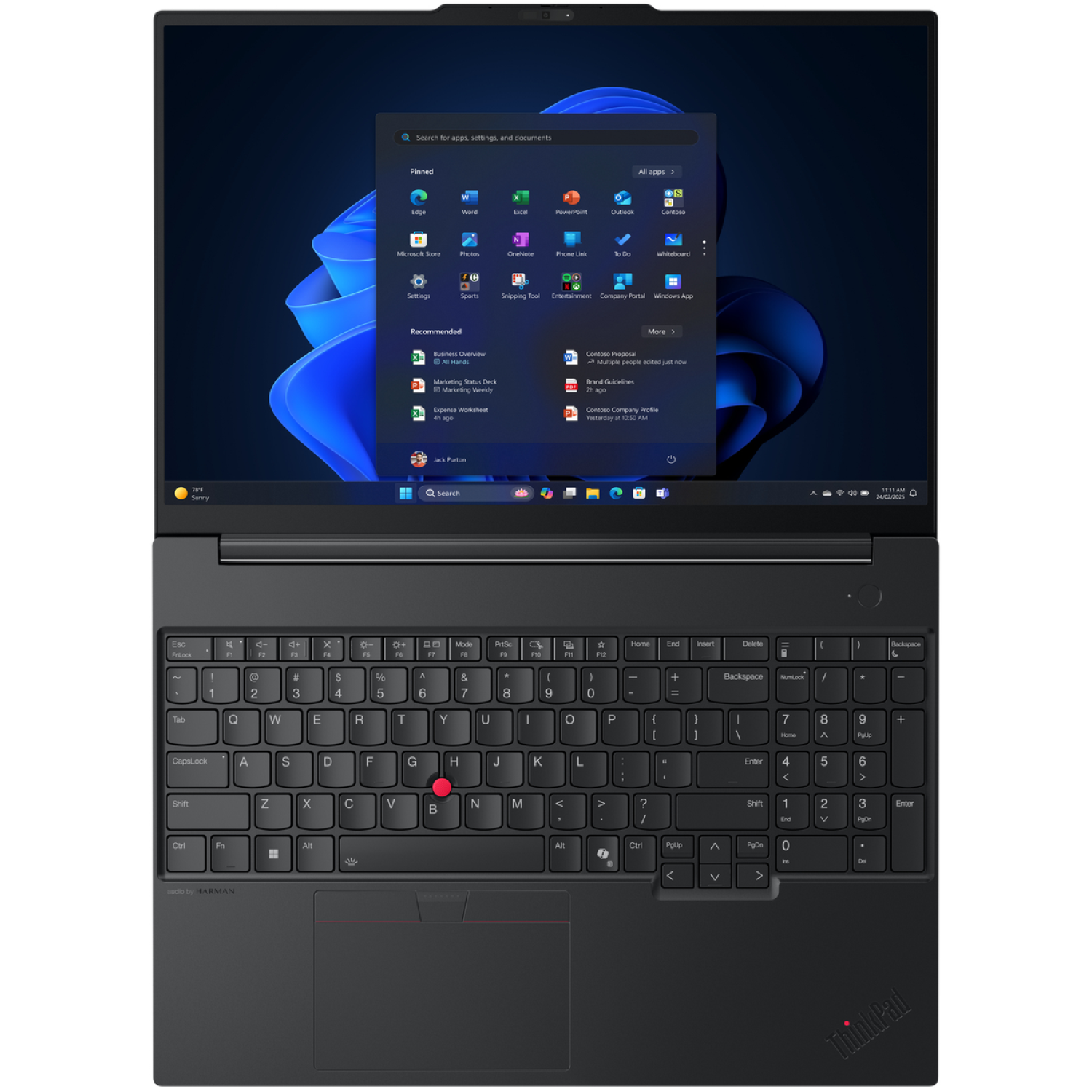 A black ThinkPad laptop displays the Windows 11 interface. The keyboard is in focus with the touchpad below.
