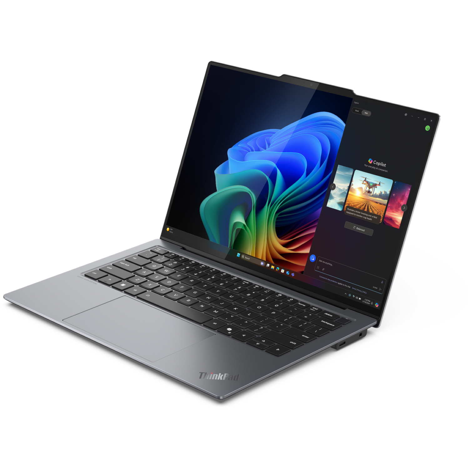 A gray ThinkPad laptop is open. The screen shows a colorful abstract image and a Copilot window with images.
