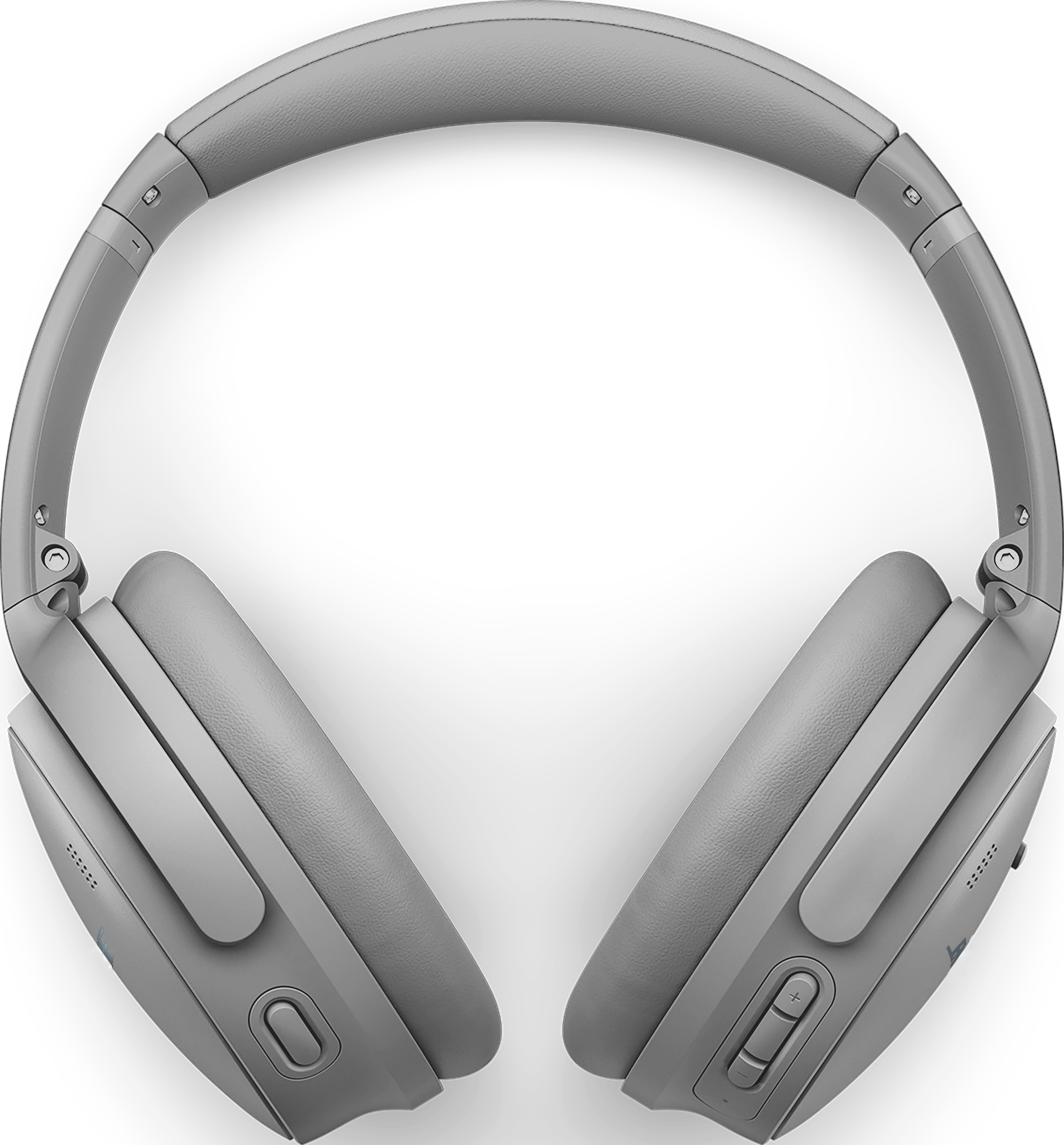 Casque gris sur fond noir. Il possède des écouteurs, un arceau et des boutons. Le design est moderne et élégant.