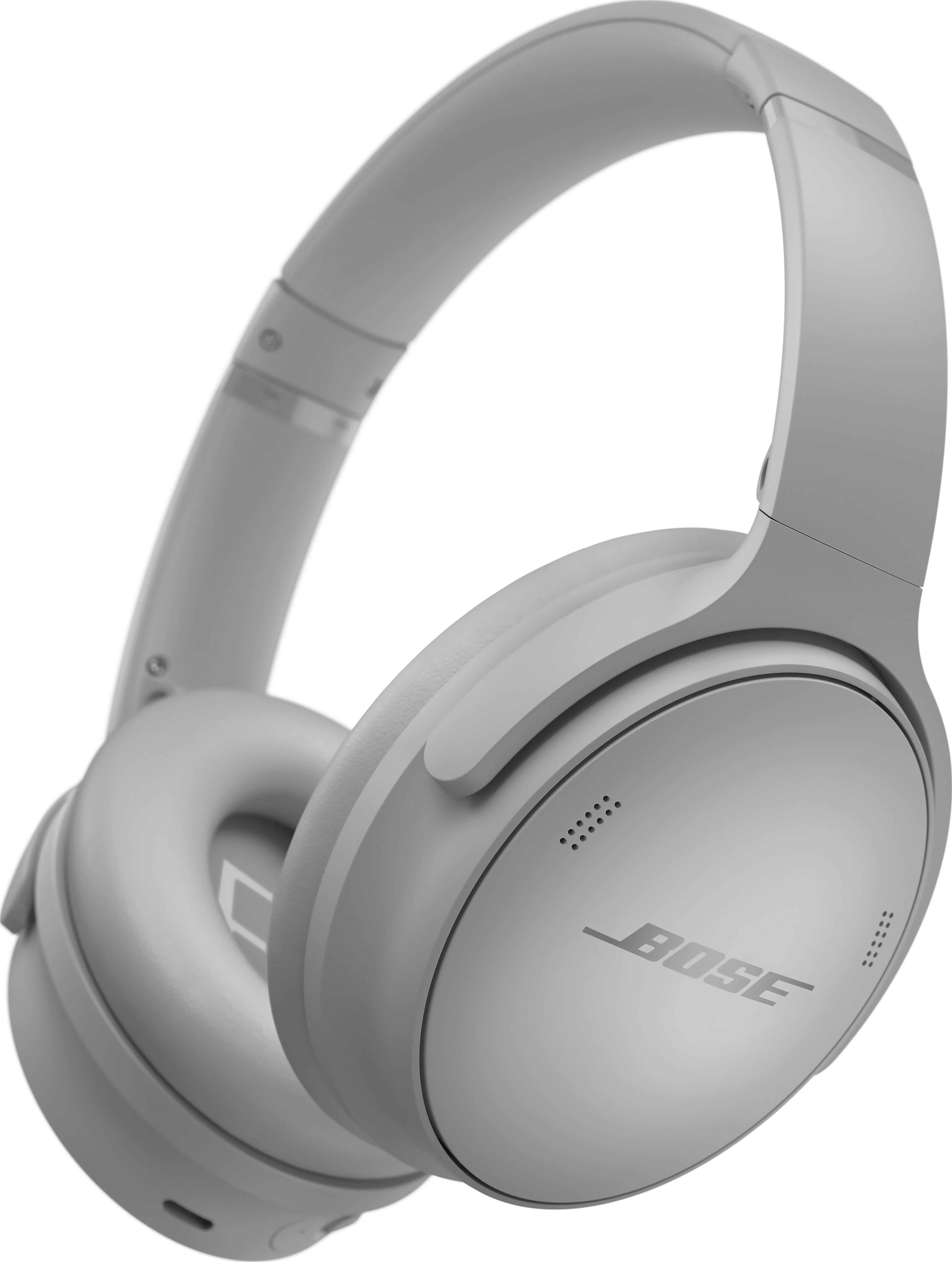 Casque Bose gris clair sur fond noir. Le casque est incliné, montrant les oreillettes et le bandeau.
