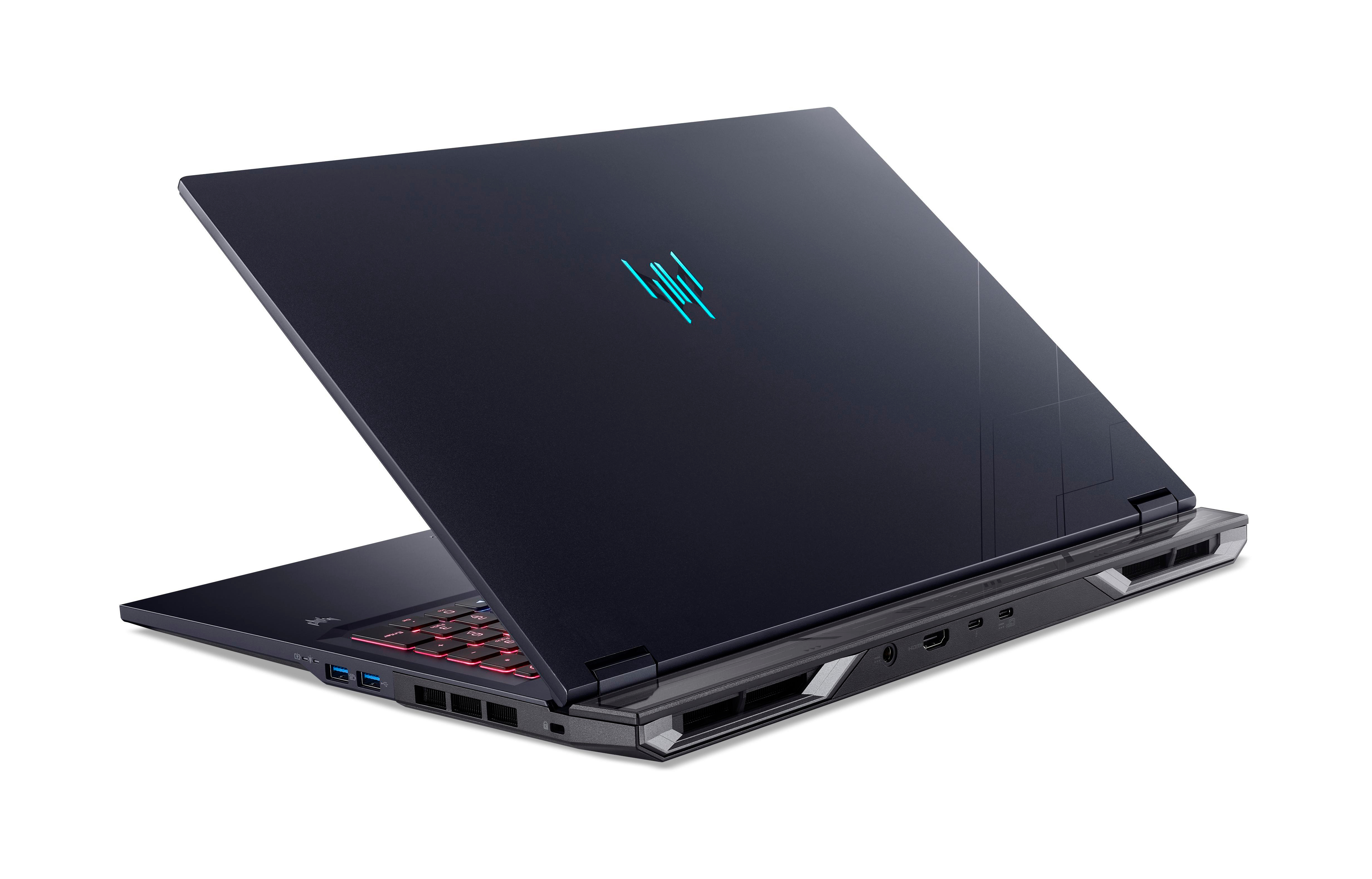 Ein dunkelblauer Laptop ist auf einer weißen Oberfläche geöffnet. Die Tastatur hat rote Lichter. Das Logo ist blau.