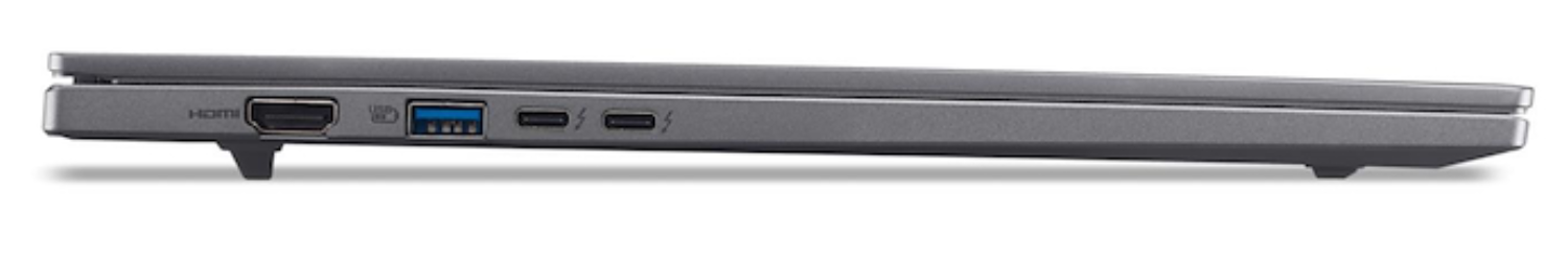 Vista lateral de un portátil gris. Los puertos visibles incluyen HDMI, USB y Thunderbolt. El portátil está ligeramente inclinado.