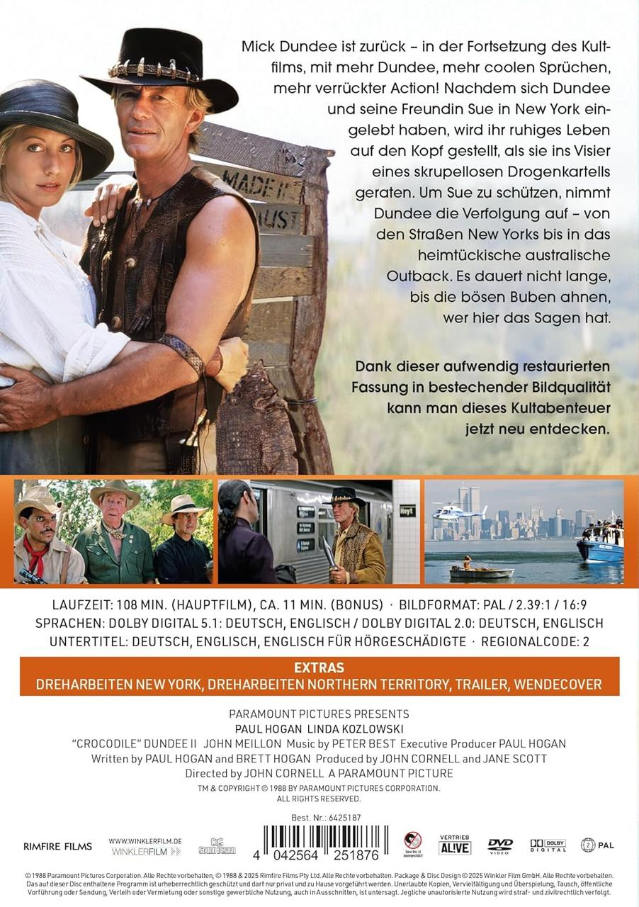 Filmposter mit Paul Hogan und einer Frau. Sie stehen vor einem Holzschild. Text auf Deutsch.