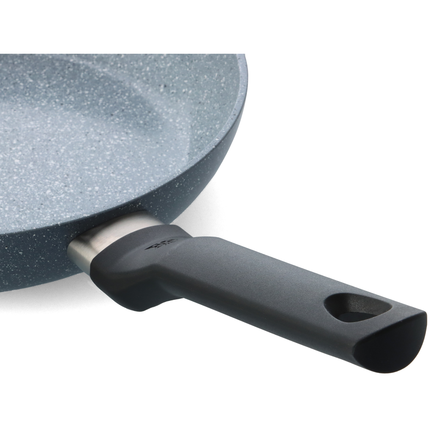 Close-up of a frying pan. Gray speckled interior, dark gray handle, metallic joint, on a white background.