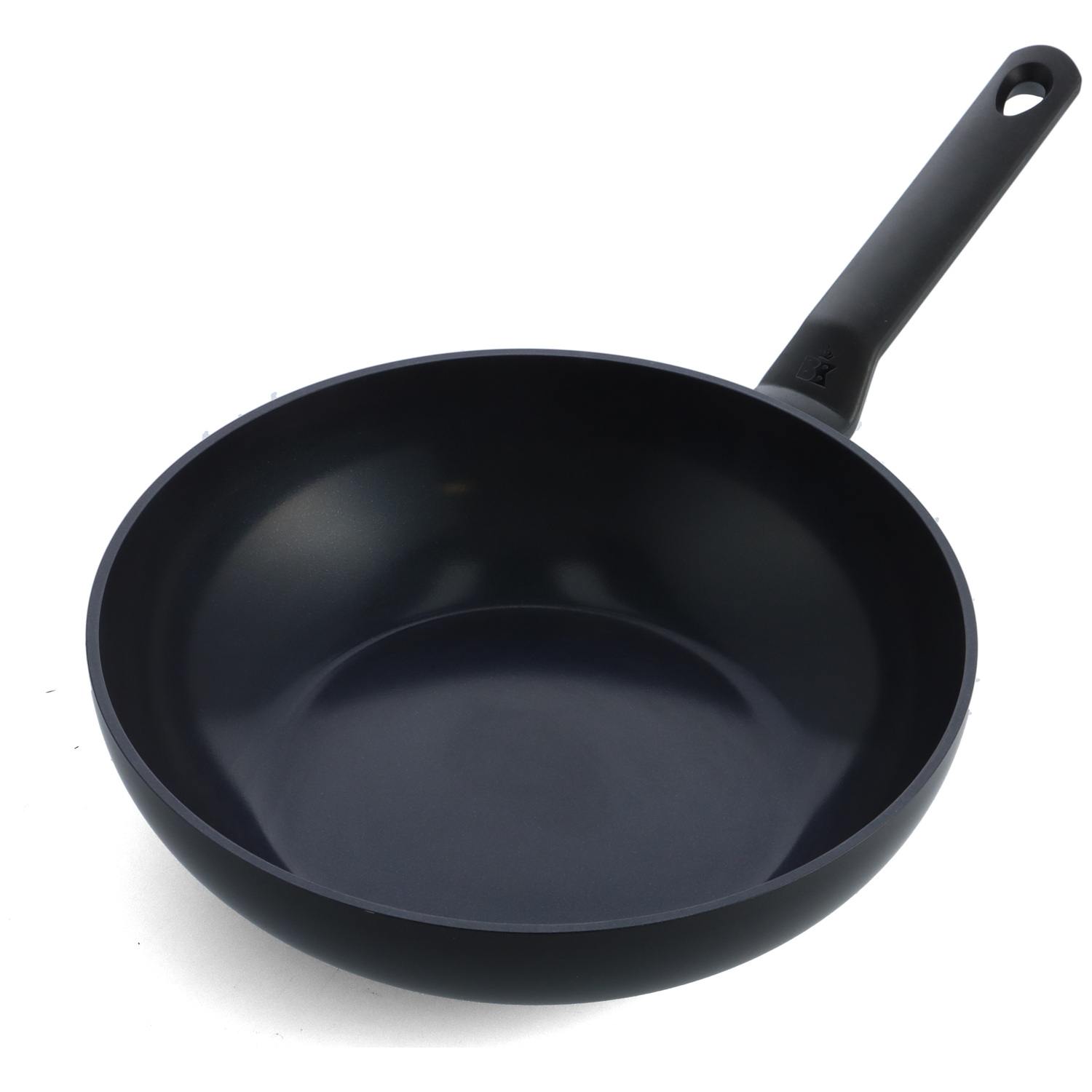 A black frying pan with a long handle. The pan is round with a deep bowl. The handle has a hole at the end.
