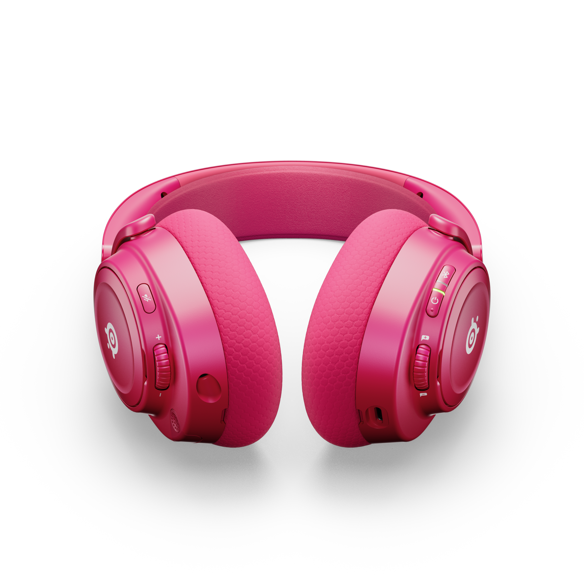 Różowe słuchawki na czarnym tle. Słuchawki mają logo i regulatory głośności.