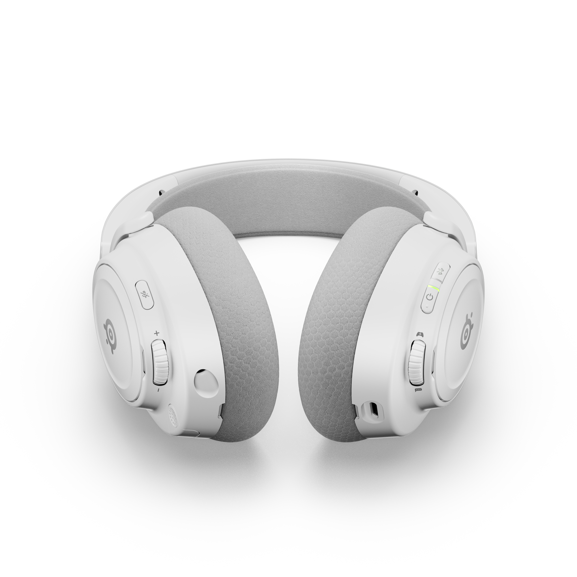 Biały zestaw słuchawkowy SteelSeries na czarnym tle. Nauszniki szare, elementy sterujące z boku. Przyciski zasilania i głośności.