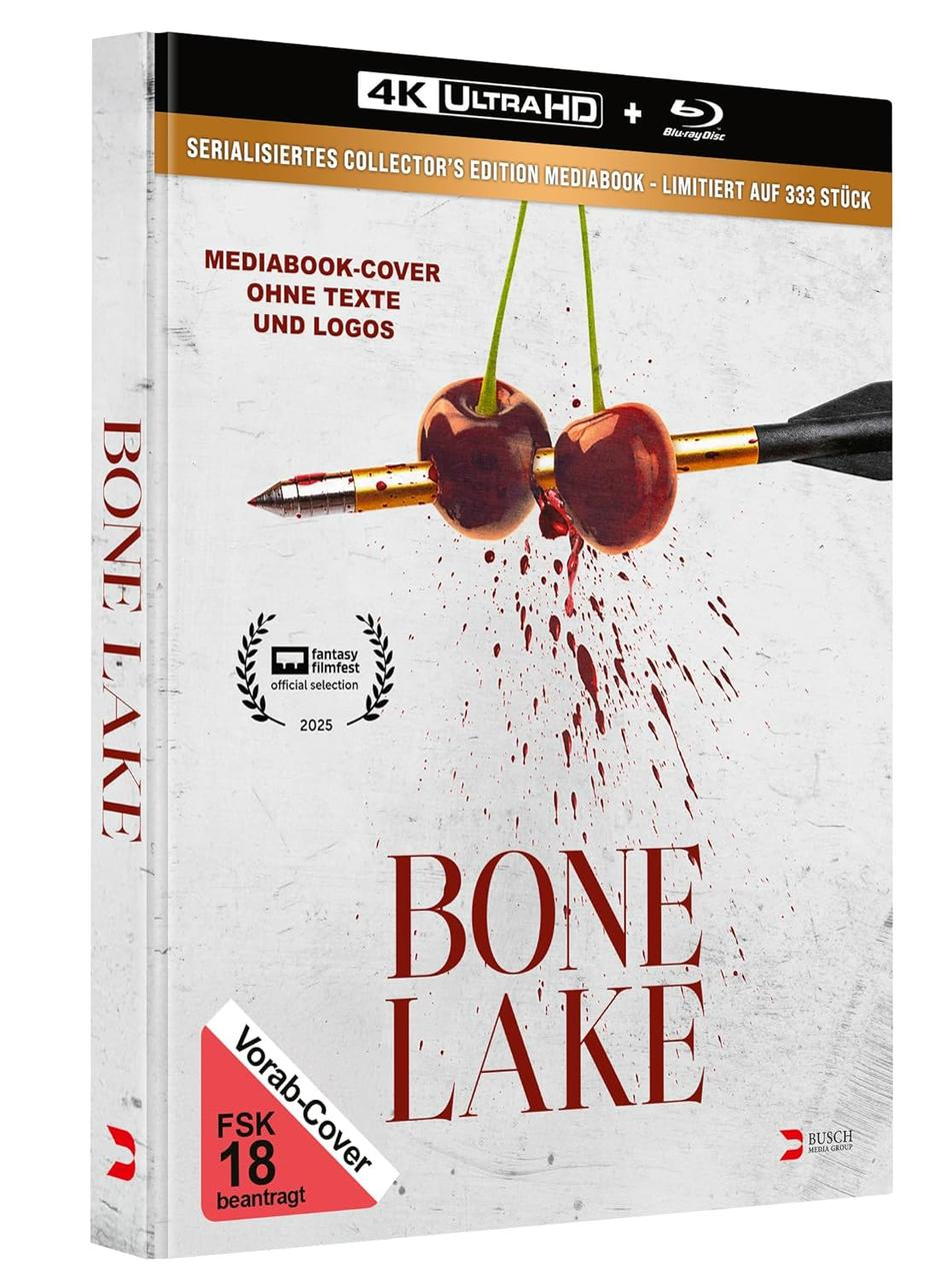 Das Cover zeigt zwei Kirschen, die von einem Pfeil durchbohrt werden, Blutspritzer und den Titel 'BONE LAKE' auf weißem Hintergrund.
