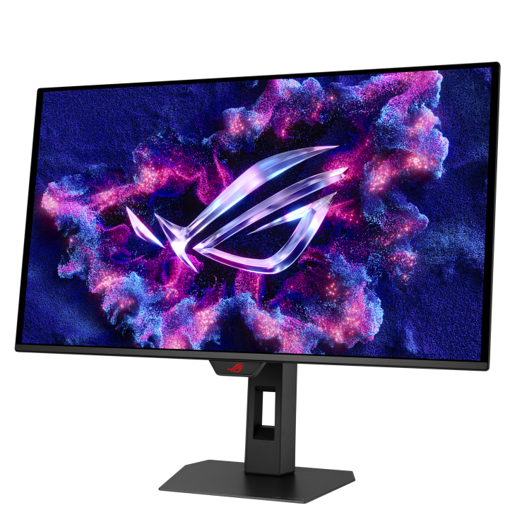 Egy fekete ROG monitor lila és rózsaszín részecskékkel jelenít meg logót sötétkék háttérrel. A monitor fekete állványon áll.