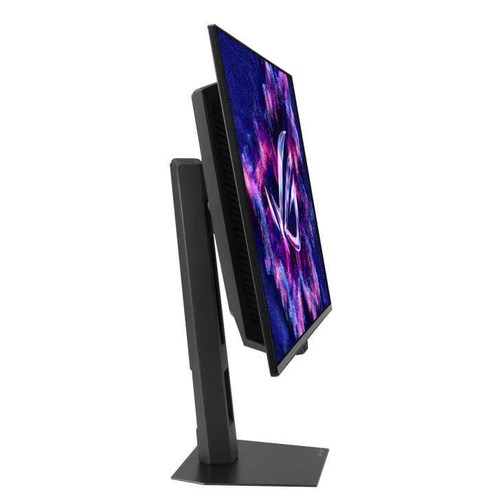 Egy fekete számítógép monitor balra dől. A képernyő egy színes absztrakt képet jelenít meg.