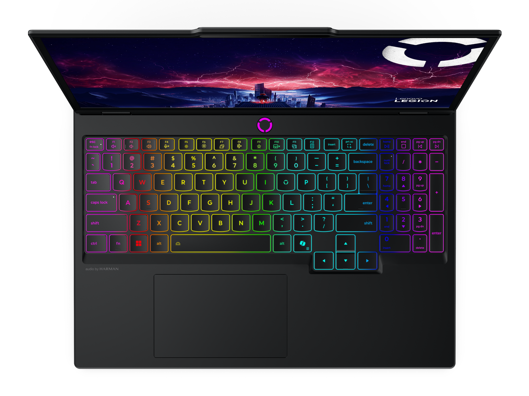 Laptop z kolorową podświetlaną klawiaturą, wyświetlający miasto nocą na ekranie. Widoczne logo Lenovo Legion.
