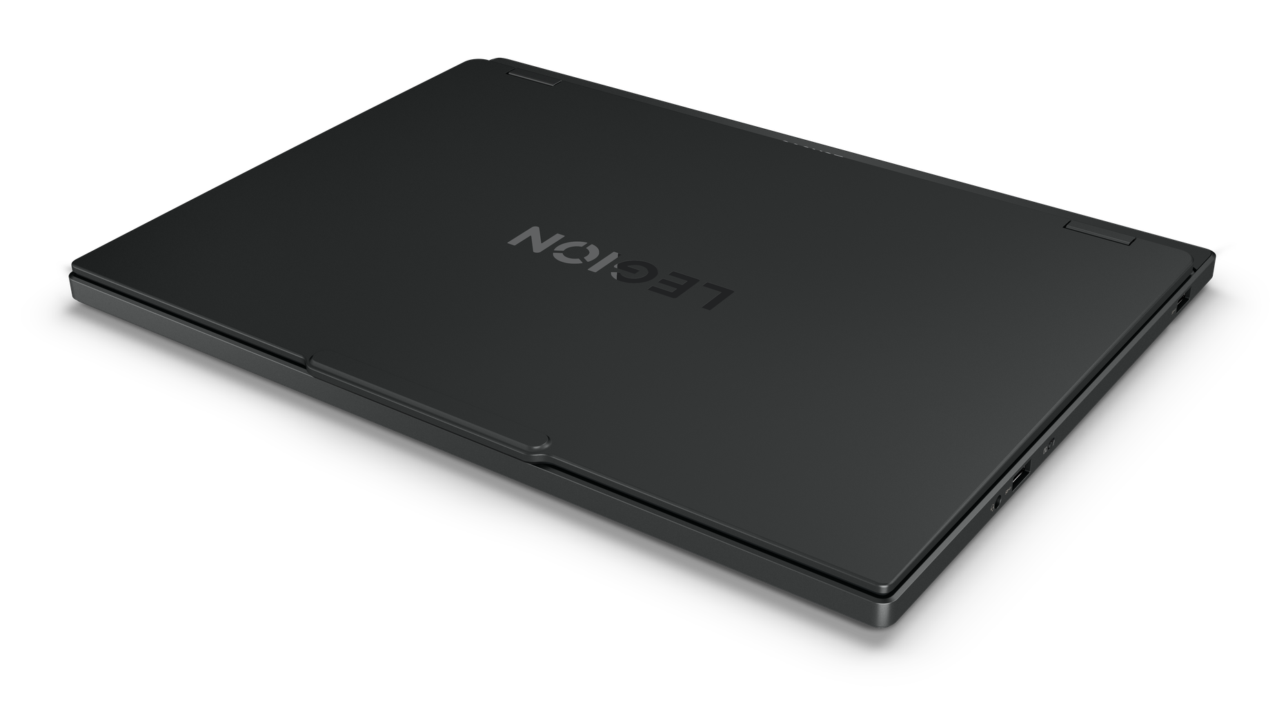 Czarny laptop Legion na czarnej powierzchni. Widoczne logo Legion. Laptop jest lekko pochylony, pokazując bok.