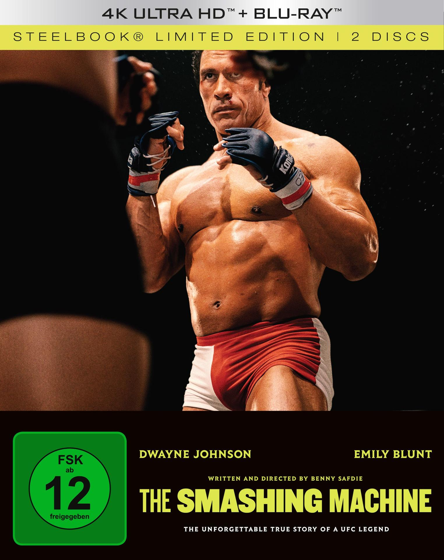 Dwayne Johnson in Boxausrüstung. Titel "The Smashing Machine". Rote Shorts, schwarze Handschuhe und muskulöser Torso. Blu-ray/Ultra HD Cover.