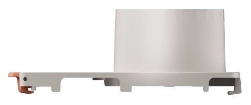 Białe i szare urządzenie z miedzianym elementem z boku. Ma cylindryczny kształt i prostokątną podstawę.