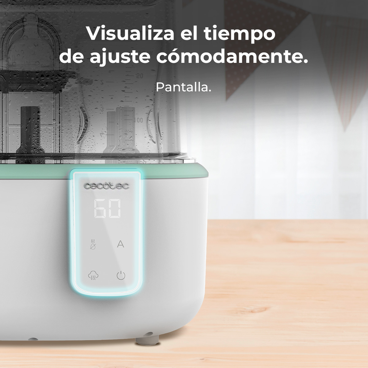 Un esterilizador de biberones blanco y menta muestra una pantalla digital con un temporizador. El fondo es una mesa de madera y una ventana.