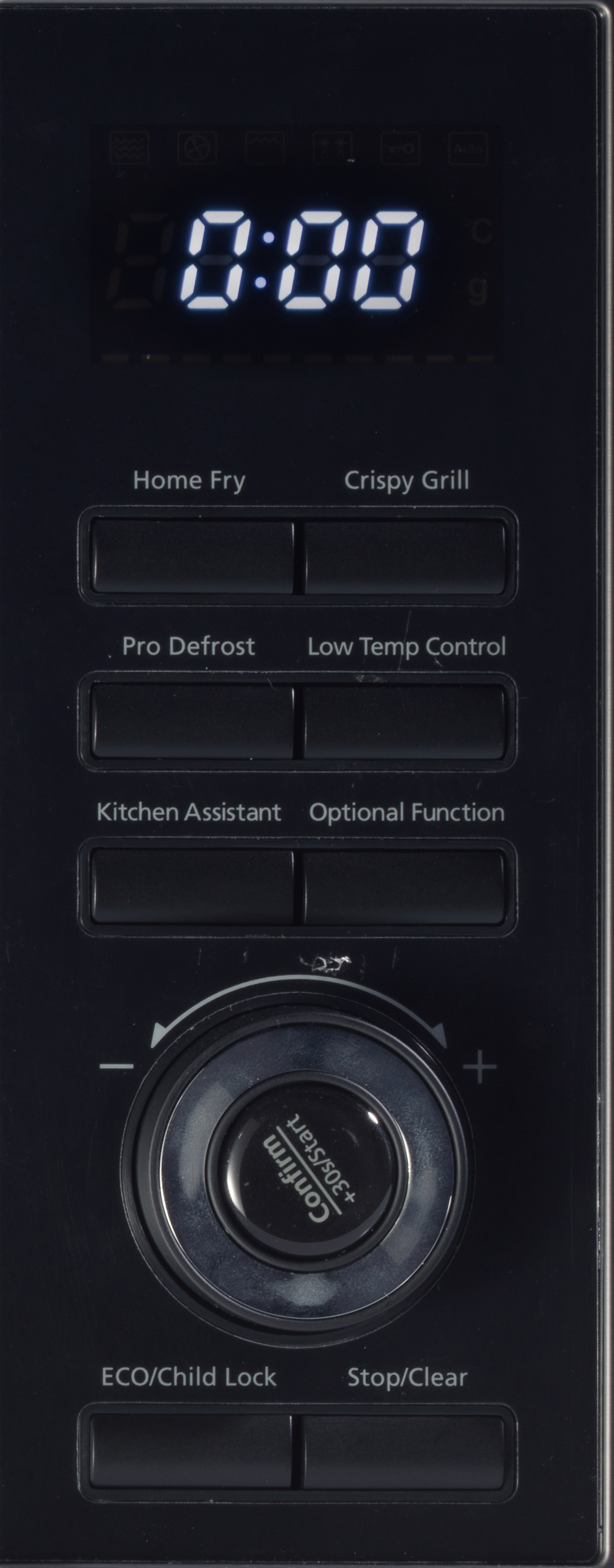 Czarny panel sterowania kuchenki mikrofalowej z cyfrowym wyświetlaczem 0:00, przyciskami, pokrętłem i etykietami tekstowymi.