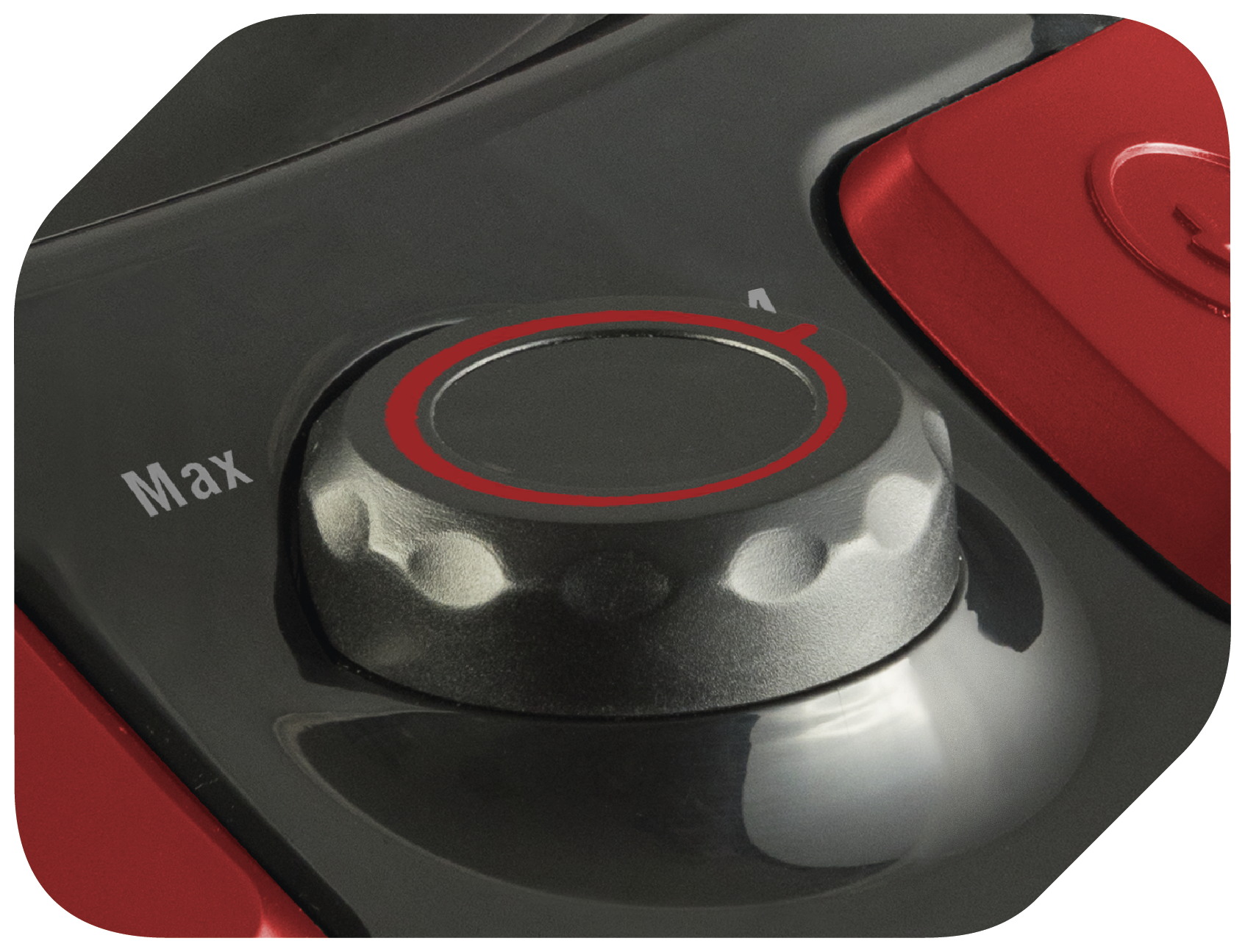 Nahaufnahme eines Bedienknopfs an einem rot-schwarzen Gerät. Der Knopf hat einen roten Ring und ist auf 'Max' eingestellt.