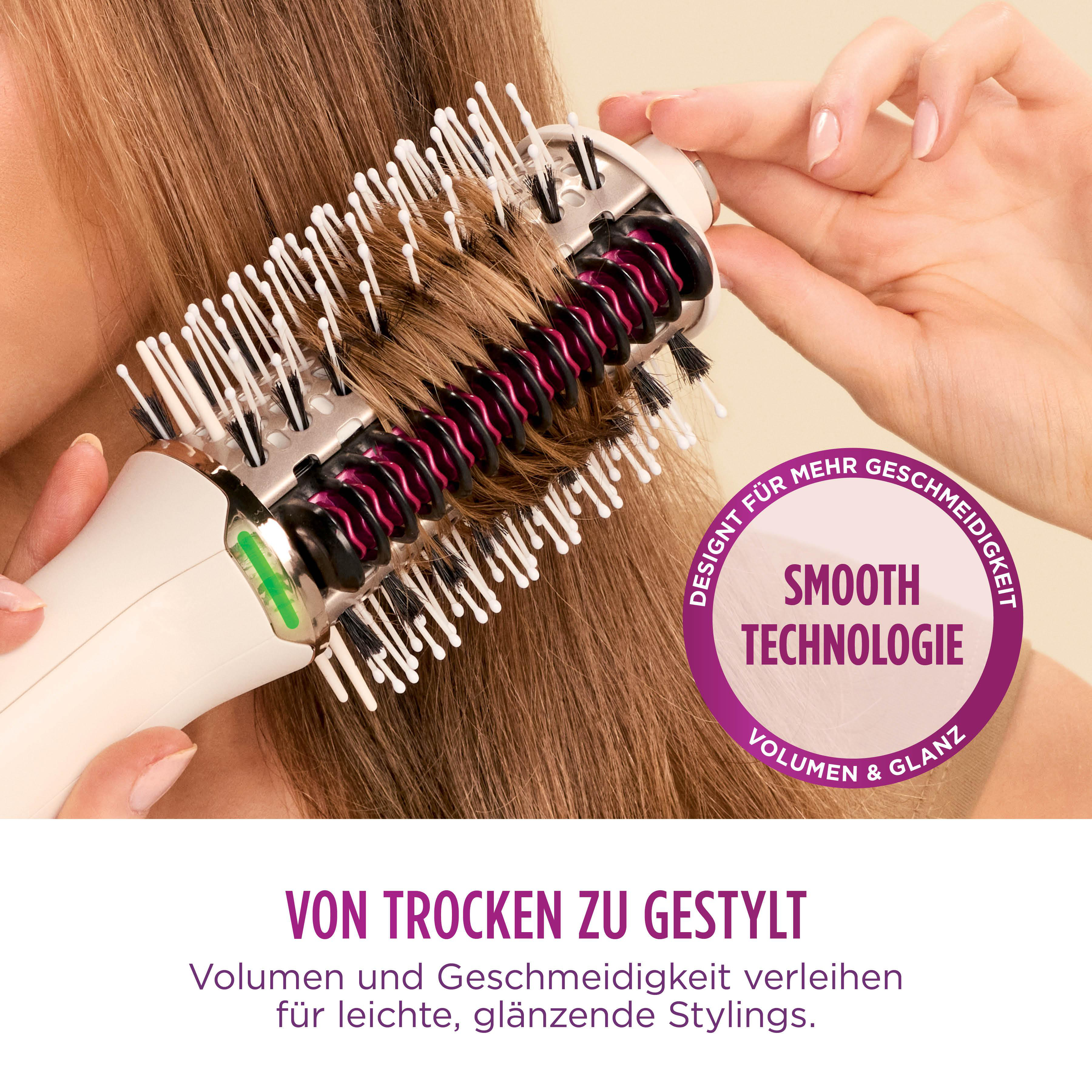 Eine Hand hält eine Haarbürste in braunem Haar. Der Text auf dem Bild lautet 'Smooth Technologie' und 'Volumen & Glanz'.